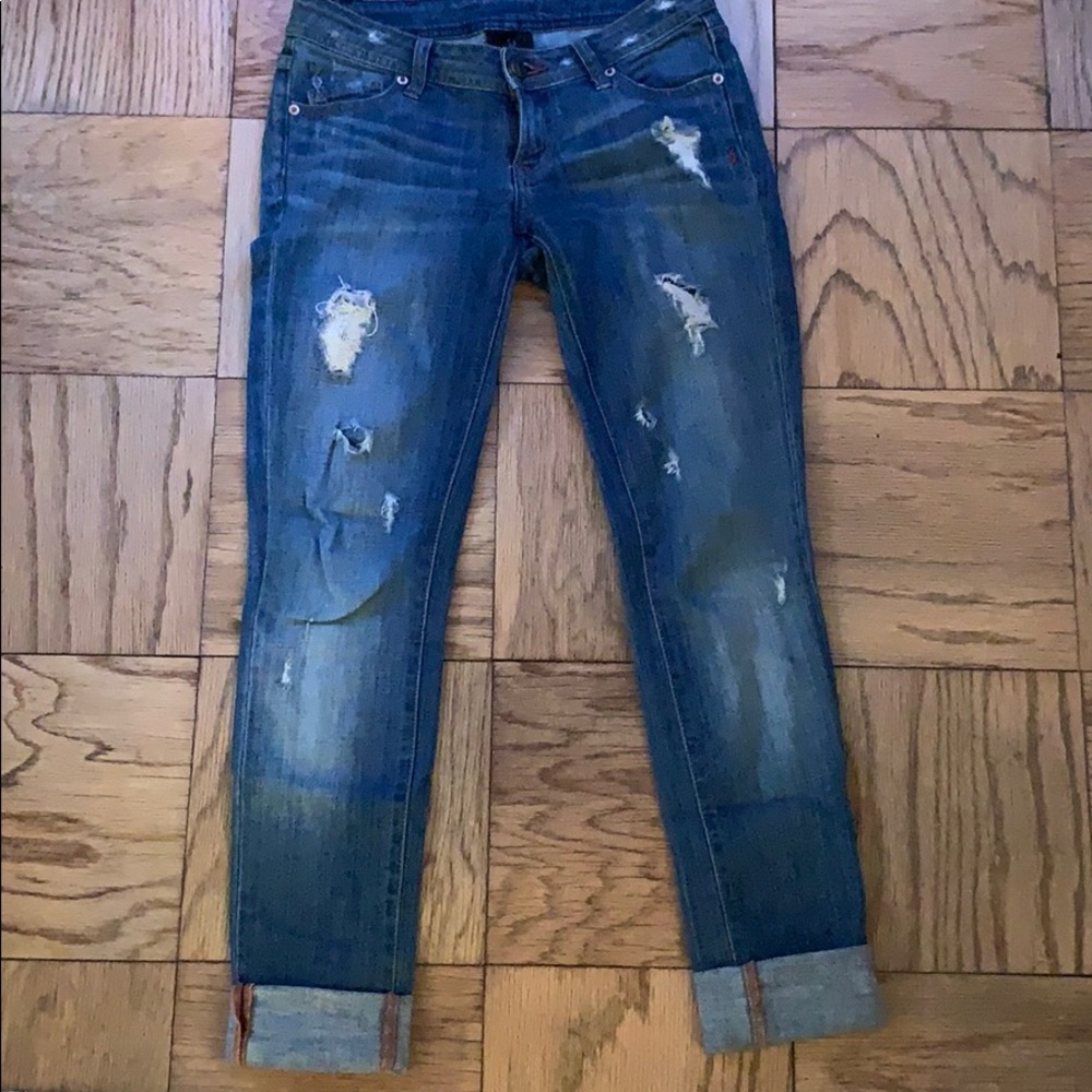 Light wash ripped jeans.